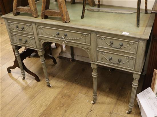 A pale blue five drawer writing table W.129cm